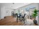 Well-lit common area features high-top seating, large windows, and stylish wood floors at 644 3Rd S Ave # 305, St Petersburg, FL 33701