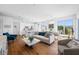 Bright living room featuring hardwood floors, modern furnishings, and an open concept design at 644 3Rd S Ave # 305, St Petersburg, FL 33701