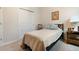 Bright bedroom with twin bed, built-in shelving and closet at 711 Old Windsor Way, Spring Hill, FL 34609
