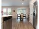 Bright dining area with access to the screened porch at 711 Old Windsor Way, Spring Hill, FL 34609