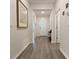 Light and bright entryway with wood-look flooring at 711 Old Windsor Way, Spring Hill, FL 34609