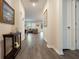 Spacious entryway with hardwood floors and view to living area at 711 Old Windsor Way, Spring Hill, FL 34609