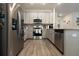 Modern kitchen featuring stainless steel appliances and light gray cabinets at 711 Old Windsor Way, Spring Hill, FL 34609