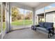 Relax in this cozy screened porch, overlooking the backyard at 711 Old Windsor Way, Spring Hill, FL 34609