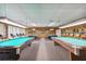 Well-lit game room featuring multiple billiard tables at 7425 Bay Island S Dr # 104, South Pasadena, FL 33707