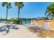 Relaxing waterfront patio with seating for residents at 7425 Bay Island S Dr # 104, South Pasadena, FL 33707