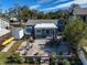 Aerial view of backyard, patio, and landscaping at 743 Chesapeake Dr, Tarpon Springs, FL 34689