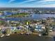 Wide aerial showcasing the home's waterfront setting at 743 Chesapeake Dr, Tarpon Springs, FL 34689