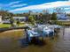 Aerial view of waterfront home with private boat dock at 743 Chesapeake Dr, Tarpon Springs, FL 34689