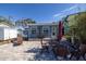 Outdoor patio with seating area and multiple plants at 743 Chesapeake Dr, Tarpon Springs, FL 34689