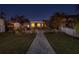 Landscaped backyard with stone patio and pathway at 743 Chesapeake Dr, Tarpon Springs, FL 34689