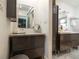 Modern bathroom with double vanity and granite countertop at 743 Chesapeake Dr, Tarpon Springs, FL 34689