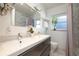 Clean bathroom, double vanity, marble shower, and window at 743 Chesapeake Dr, Tarpon Springs, FL 34689