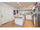 Modern kitchen featuring granite countertops and stainless steel appliances at 743 Chesapeake Dr, Tarpon Springs, FL 34689