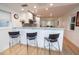 Modern kitchen with breakfast bar and white cabinetry at 743 Chesapeake Dr, Tarpon Springs, FL 34689
