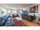 Living room with leather sofas, marble coffee table, and water views at 743 Chesapeake Dr, Tarpon Springs, FL 34689