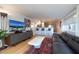 Living room with leather sofa, marble coffee table, and water views at 743 Chesapeake Dr, Tarpon Springs, FL 34689
