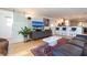 Spacious living room with leather sofa and large TV at 743 Chesapeake Dr, Tarpon Springs, FL 34689