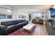 Bright living room with leather sofas and water views at 743 Chesapeake Dr, Tarpon Springs, FL 34689