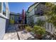 Charming patio with potted plants and a yellow door at 743 Chesapeake Dr, Tarpon Springs, FL 34689