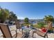 Relaxing patio with seating area, overlooking the water at 743 Chesapeake Dr, Tarpon Springs, FL 34689