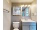 Updated bathroom with vanity, toilet and medicine cabinet at 7499 7Th N St, St Petersburg, FL 33702