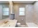 Clean bathroom, bathtub and sink with updated fixtures at 7499 7Th N St, St Petersburg, FL 33702
