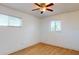 Spacious bedroom with wood floors and ceiling fan at 7499 7Th N St, St Petersburg, FL 33702