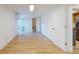Light-filled bedroom featuring wood-look floors and access to bathroom at 7499 7Th N St, St Petersburg, FL 33702