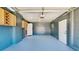 Spacious garage with built-in cabinets and an automatic garage door opener at 7499 7Th N St, St Petersburg, FL 33702