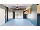 Garage featuring an automatic door opener and additional storage at 7499 7Th N St, St Petersburg, FL 33702