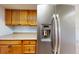 Close up of the kitchen's stainless steel refrigerator at 7499 7Th N St, St Petersburg, FL 33702