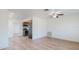 Open living room and kitchen area with wood-look floors at 7499 7Th N St, St Petersburg, FL 33702