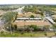 Aerial view of townhouses with parking and landscaping at 7606 Woodbridge Blvd, Tampa, FL 33615