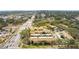 Aerial view showing townhouses, pool, and surrounding area at 7606 Woodbridge Blvd, Tampa, FL 33615