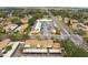 Aerial perspective of townhouses near a commercial building at 7606 Woodbridge Blvd, Tampa, FL 33615