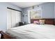Bedroom with a wooden sleigh bed and a workspace at 7606 Woodbridge Blvd, Tampa, FL 33615