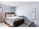 Bedroom with a full bed and pink accents at 7606 Woodbridge Blvd, Tampa, FL 33615
