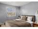Primary bedroom with a neutral color scheme and large bed at 7606 Woodbridge Blvd, Tampa, FL 33615