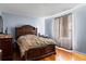 Bedroom with a double bed and wood flooring at 7606 Woodbridge Blvd, Tampa, FL 33615