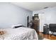 Bedroom with a full bed, dresser, and workspace at 7606 Woodbridge Blvd, Tampa, FL 33615