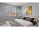 Bedroom with a neutral color scheme and large bed at 7606 Woodbridge Blvd, Tampa, FL 33615
