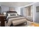 Bright bedroom with a queen-size bed and neutral decor at 7606 Woodbridge Blvd, Tampa, FL 33615