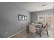 Bright dining area with table and chairs, and access to a patio at 7606 Woodbridge Blvd, Tampa, FL 33615