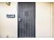 Black metal security door with a mailbox at 7606 Woodbridge Blvd, Tampa, FL 33615