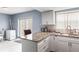 Modern kitchen with granite countertops and island at 7606 Woodbridge Blvd, Tampa, FL 33615