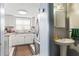 Kitchen features granite countertops and white cabinets at 7606 Woodbridge Blvd, Tampa, FL 33615