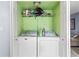 Stackable washer and dryer in a closet at 7606 Woodbridge Blvd, Tampa, FL 33615