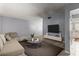 Living room with beige sectional sofa and large TV at 7606 Woodbridge Blvd, Tampa, FL 33615