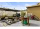 Small patio with grill, table, and potted plants at 7606 Woodbridge Blvd, Tampa, FL 33615